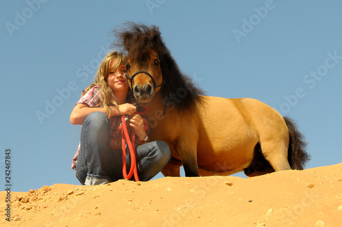 Little girl with pony