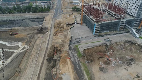 Construction of roads and buildings on the territory of the former factory. Aerial video shooting. photo