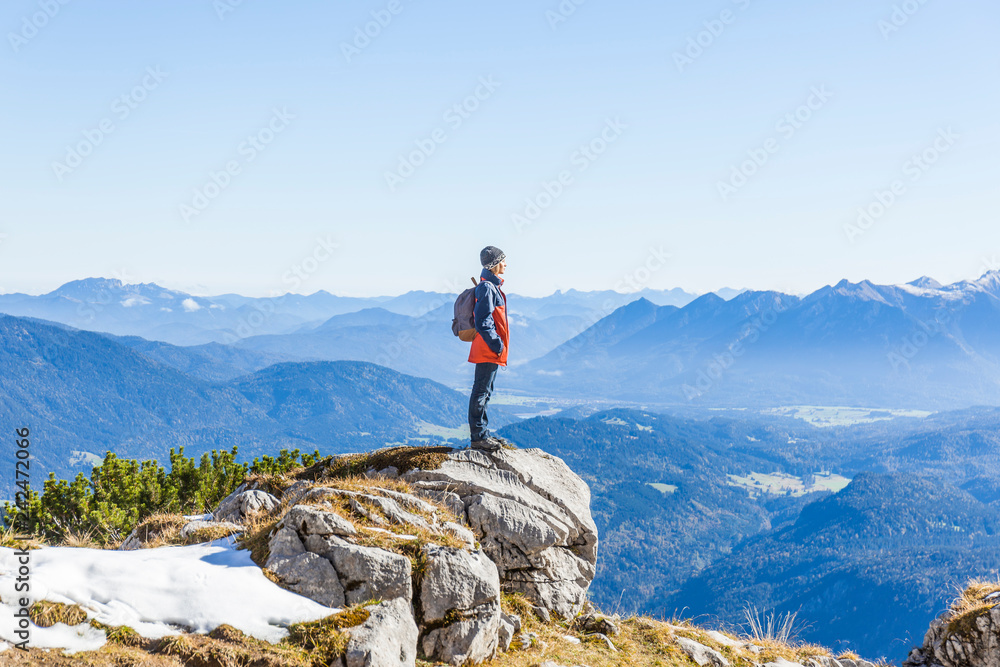 Germany, Garmisch-Partenkirchen, Alpspitze, Osterfelderkopf, female hiker on viewpoint looking at view Germany, Garmisch-Partenkirchen, Alpspitze, Osterfelderkopf, female hiker on viewpoint looking at view