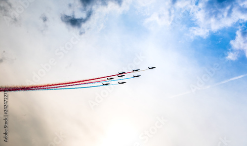 jet squadron releasing colorful smoke