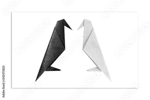  Origami. White and black Raven opposite each other. The concept of minimalism.
