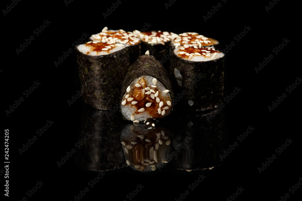 various sushi, rolls on a black background with reflection. especially for cafes and restaurants various sushi, rolls on a black background with reflection. especially for cafes and restaurants