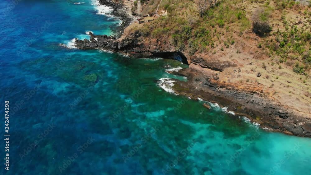 Aerial drone view of blue ocean, rocks with stones Aerial drone view of blue ocean, rocks with stones