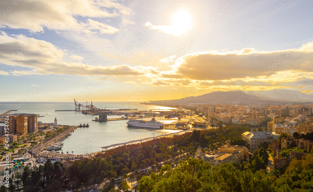 Cityscape of Malaga in Costa del Sol, Spain. Port of Malaga (Muelle Uno) and views of nature and buildings on a sunny day. Views from The Alcazaba.