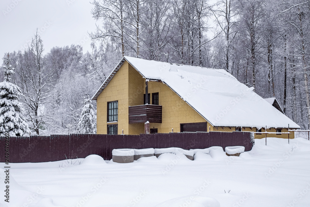 country house on a snow-covered plot country house on a snow-covered plot
