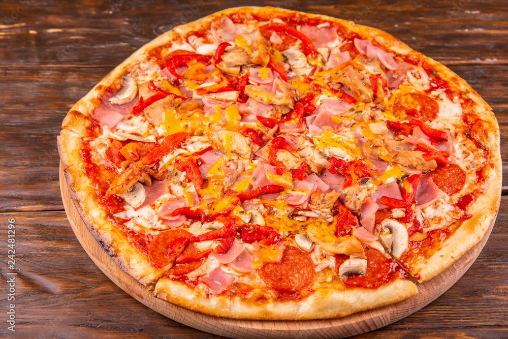 Pepperoni with sausage, cheese, tomatoes and pepper