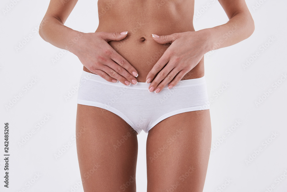 Perfect slim female body isolated on white background Perfect slim female body isolated on white background