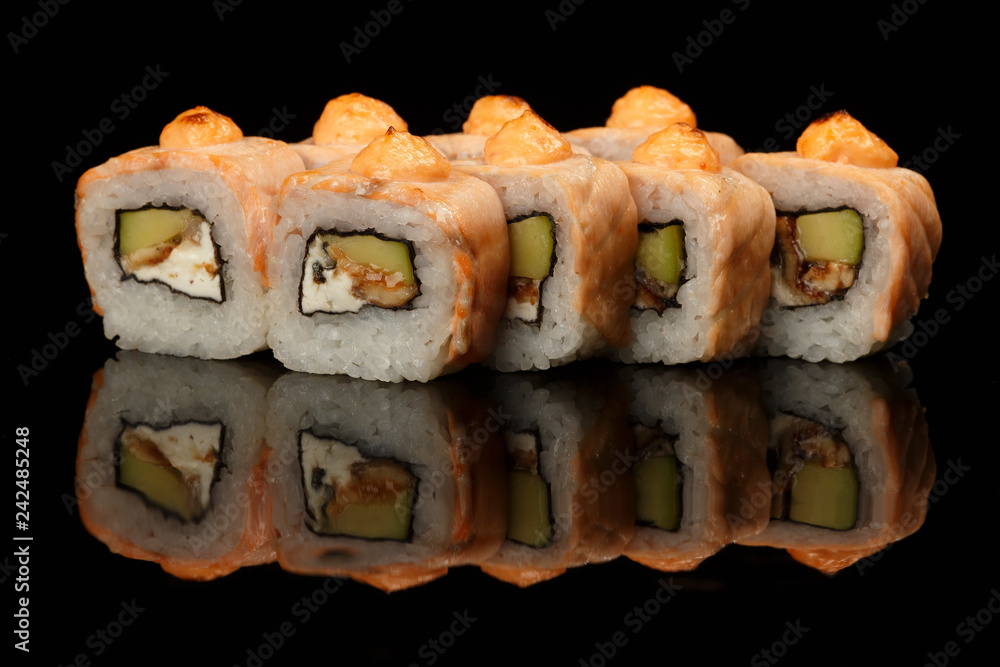 various sushi, rolls on a black background with reflection. especially for cafes and restaurants various sushi, rolls on a black background with reflection. especially for cafes and restaurants