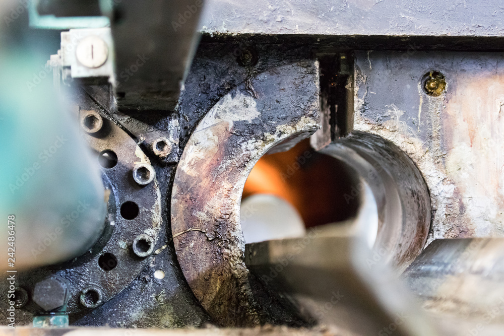 Detail of the entrance of a aluminiun log furnace before the extrusion process Detail of the entrance of a aluminiun log furnace before the extrusion process