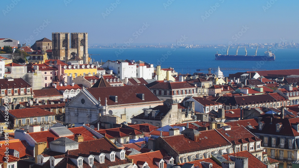 Aerial view of Lisbon, Portugal with the Lisbon Cathedral and a ship on horizon