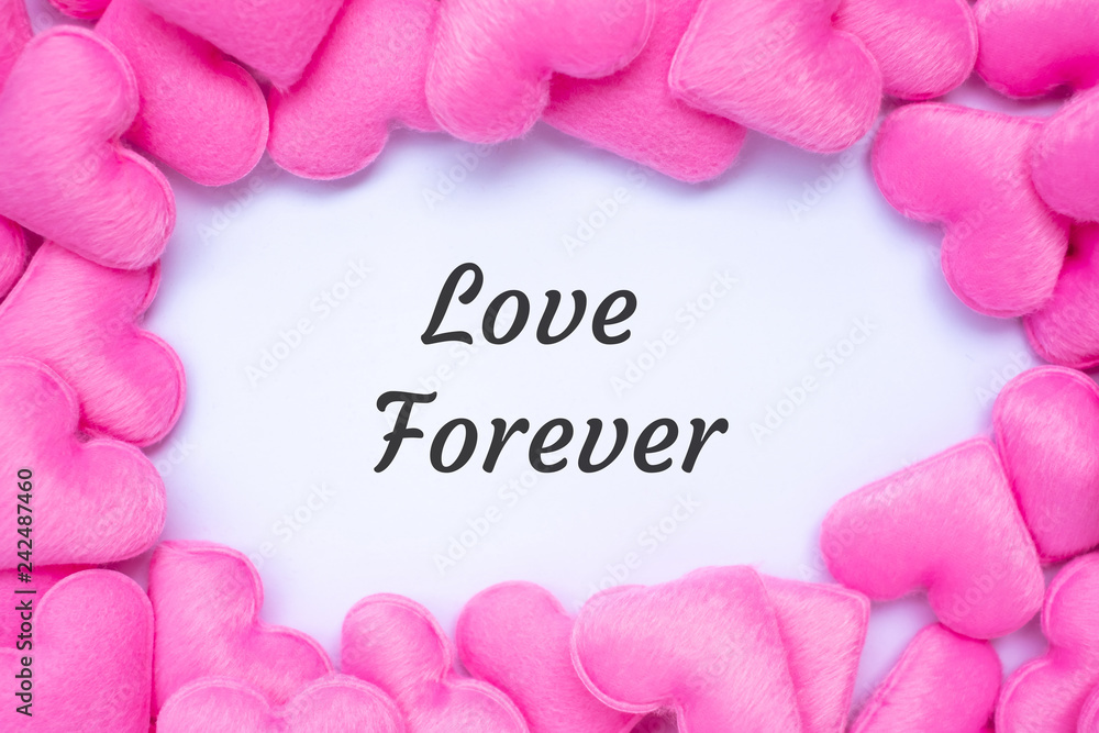 LOVE FOREVER word with pink heart shape decoration background. Love, Wedding, Romantic and Happy Valentine’ s day holiday concept