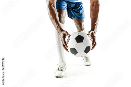 The legs of soccer player close-up isolated on white. African american model in action or movement with ball. The football  game  sport  player  athlete  competition concept