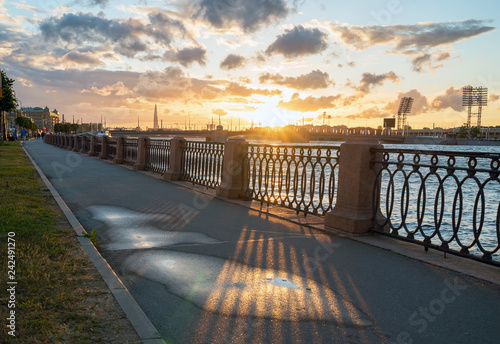 Makarova embankment, in the evening at sunset in the direction of Petrovsky stadium . Saint-Petersburg photo