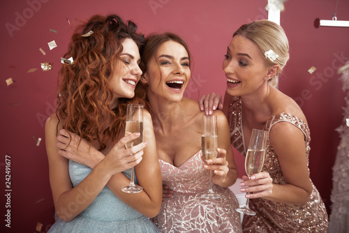 Waist up of happy ladies enjoying girls party