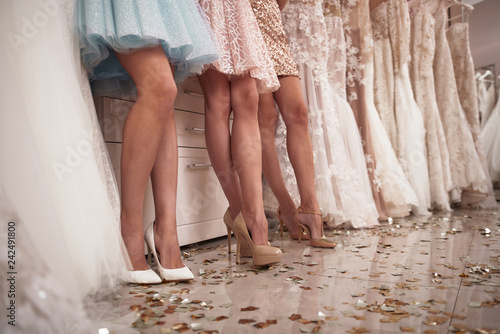 Low angle of elegant ladies legs in wedding salon