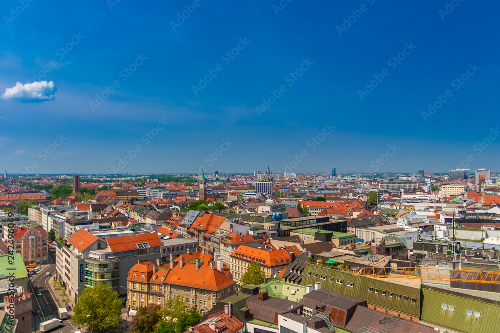 Nice aerial view of Munich's interesting cityscape on a nice sunny day with a blue sky in Bavaria, Germany. The downtown of Munich is one of the most popular tourist destination in Germany.