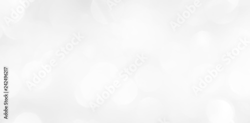 A brilliant blurry white background for a festive mood. Template for greeting card for entertainment.