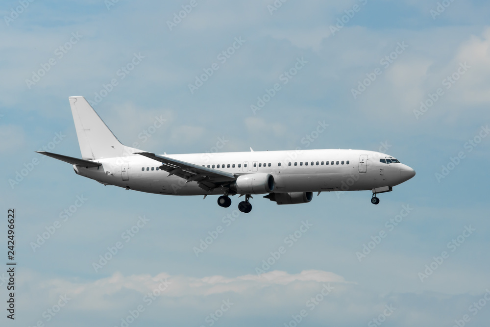 Civilian twin-engine airplane landing at international airport Civilian twin-engine airplane landing at international airport
