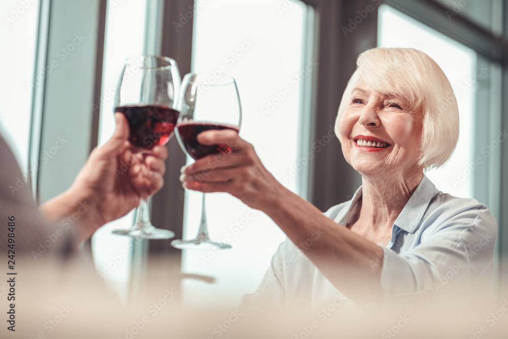 Beautiful retired lady drinking wine with a man Beautiful retired lady drinking wine with a man