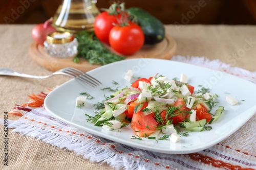 Fresh tomato salad with herbs and cheese.