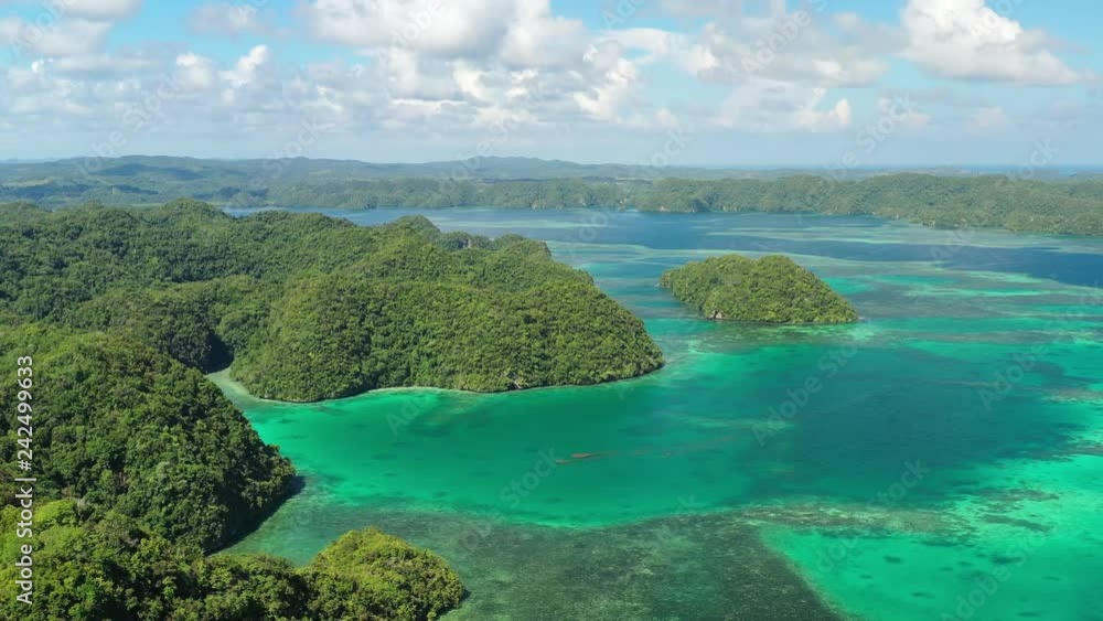 Aerial view of Koror island, many lush green islets and lagoons and azure crystal clear water of western Pacific Ocean - landscape panorama of Micronesia from above, Palau Aerial view of Koror island, many lush green islets and lagoons and azure crystal clear water of western Pacific Ocean - landscape panorama of Micronesia from above, Palau