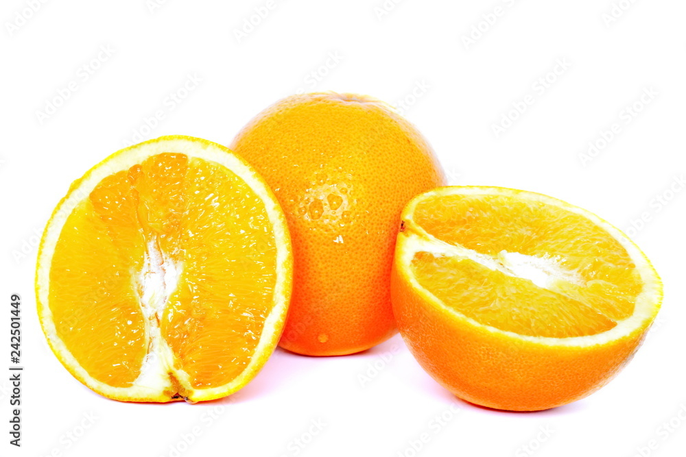 Two halves and whole yellow juicy fresh orange on white background. Isolated Two halves and whole yellow juicy fresh orange on white background. Isolated
