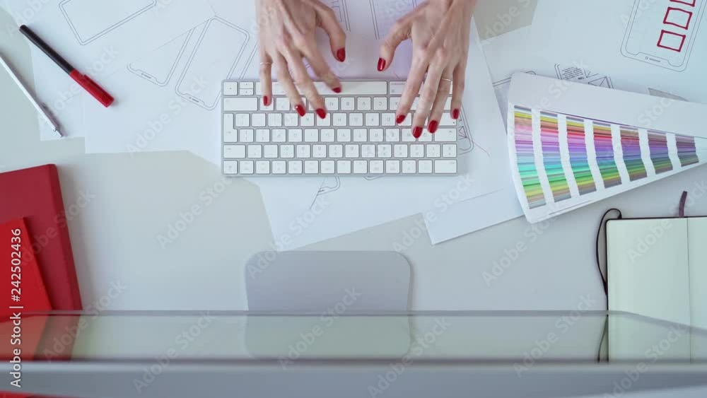 Web designer at work. Graphic designer. Mobile application design. Designer desk. UX, UI design. Thumbnails of a mobile application sketches. Laptop, sketchbook, pencil on the table.