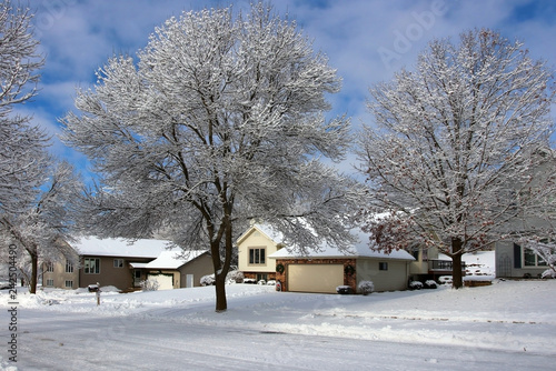 Fototapeta Naklejka Na Ścianę i Meble -  Beautiful winter morning background. Winter landscape with small town street view after blizzard. Winter snowy day background.