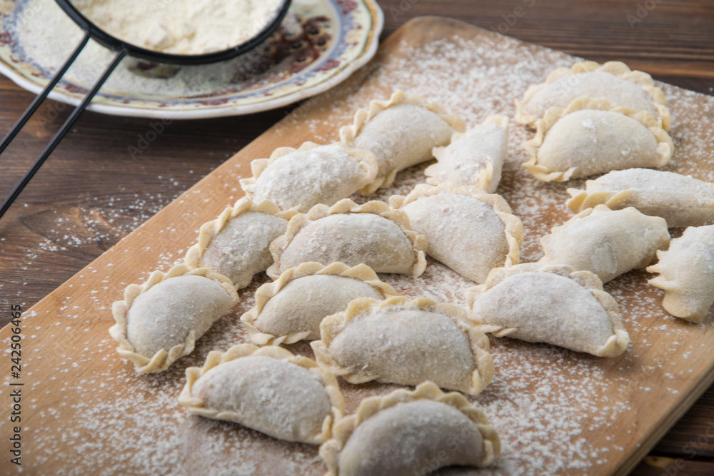 homemade meat dumplings on a wooden board homemade meat dumplings on a wooden board