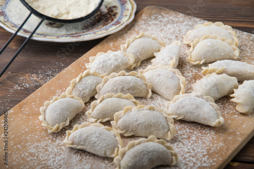 homemade meat dumplings on a wooden board