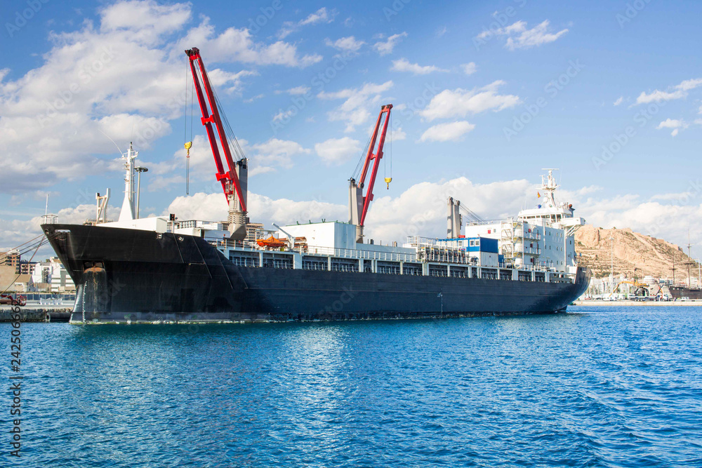 Big iron ship in marina on Mediterranean sea coast Alicante