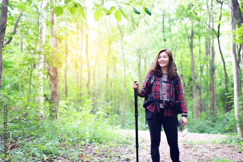 happy smiling wanderlust Asian women tourist hipster backpack to travel and rise hand in green wild forest trip hiking outdoor vacation make a journey holiday,nature lifestyle, Traveler hike concept happy smiling wanderlust Asian women tourist hipster backpack to travel and rise hand in green wild forest trip hiking outdoor vacation make a journey holiday,nature lifestyle, Traveler hike concept