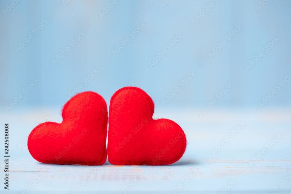 Fototapeta premium red couple heart shape decoration on blue wooden table background. Wedding, Romantic and Happy Valentine’ s day holiday concept