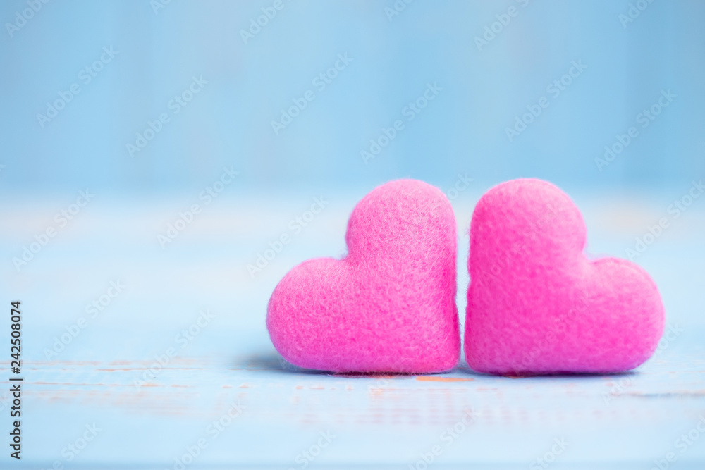 Obraz premium pink couple heart shape decoration on blue wooden table background. Wedding, Romantic and Happy Valentine’ s day holiday concept