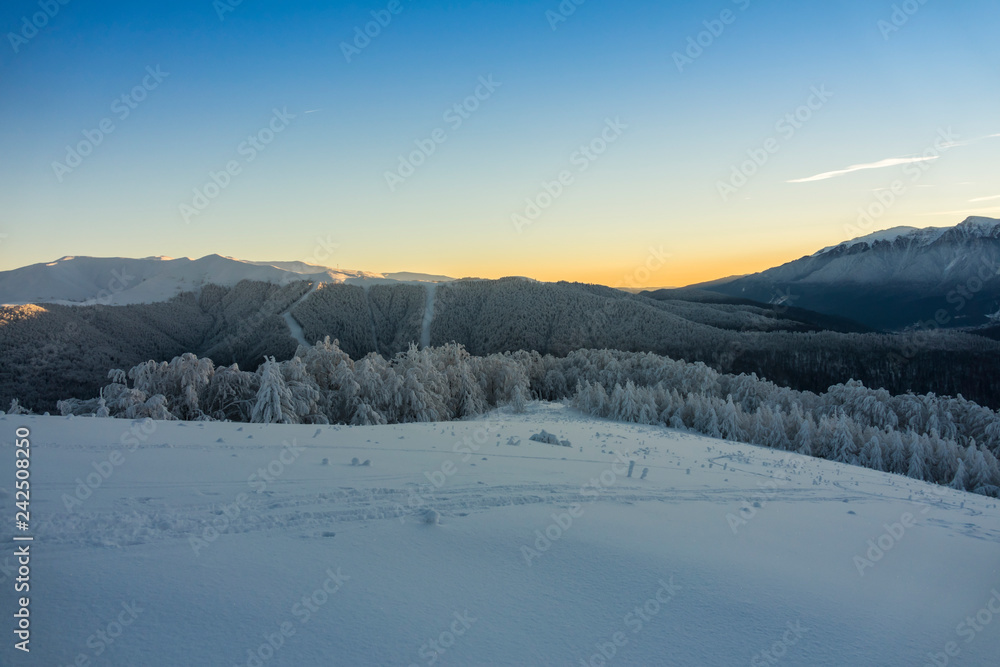 Fantastic winter mountain landscape glowing by sunlight Fantastic winter mountain landscape glowing by sunlight
