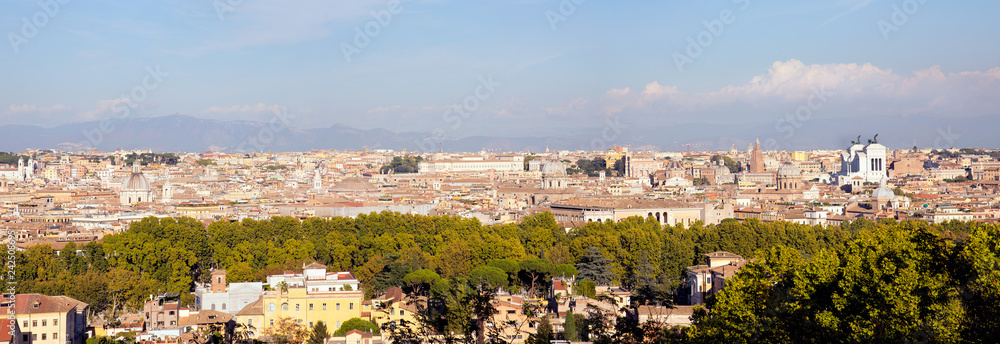 View over Rome bathing in autumn sun seen from the Janiculum hill west of the city. With landmarks as the Pantheon and the Vittorio Emanuele II monument. 