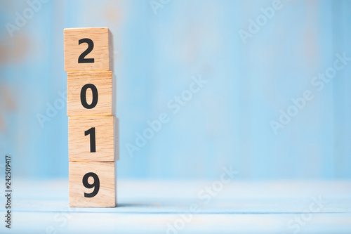 2019 new year wooden cubes on blue table background with copy space for text. Business Goals, Mission, Resolution, New Year New You concept
