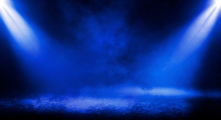 Blue misty dark background. Dark street with smoke, fog, blue spotlights, neon. Dark abstract empty background.