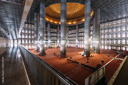 Masjid Istiqlal Interior with prayers in Indonesia is the largest mosque in Southeast Asia. Named 