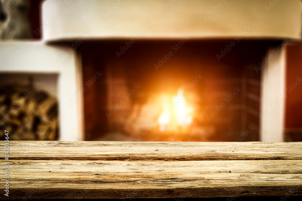 Wooden table of free space and fireplace Wooden table of free space and fireplace