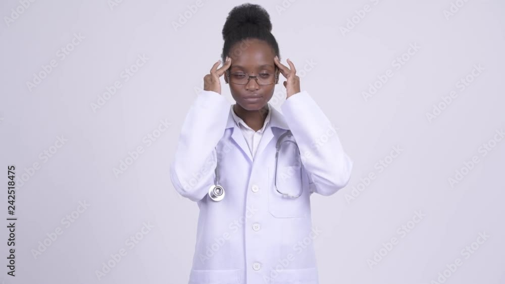 Young stressed African woman doctor with having headache