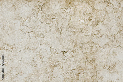 Old beige stone granite wall background texture