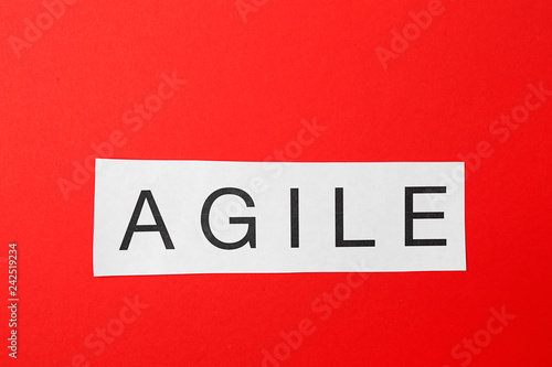 Word AGILE on color background