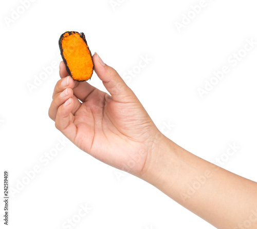 Hand holding roll sushi isolated on white background