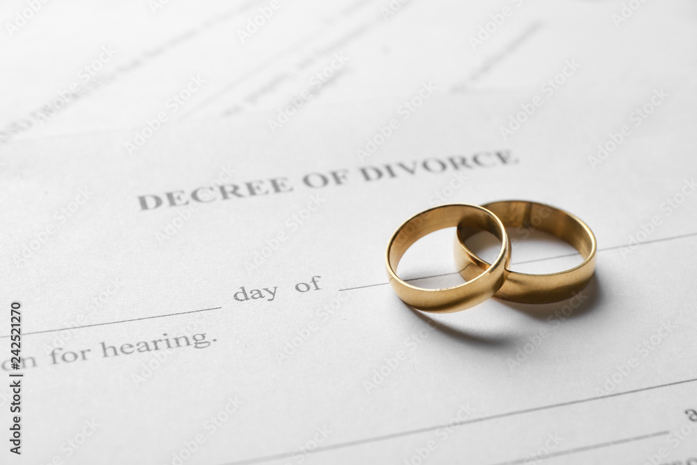 Rings with decree of divorce, closeup Rings with decree of divorce, closeup