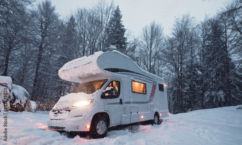 motorhome camper van in the nature, nomad van life for traveler in the winter holiday