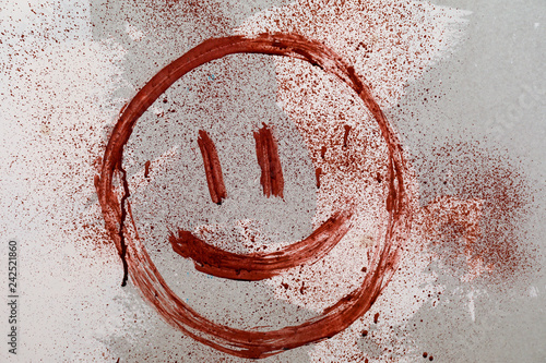 Emoticon drawn with blood o...