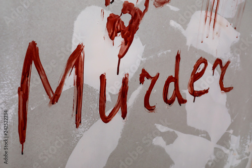 Word MURDER written in bloo...