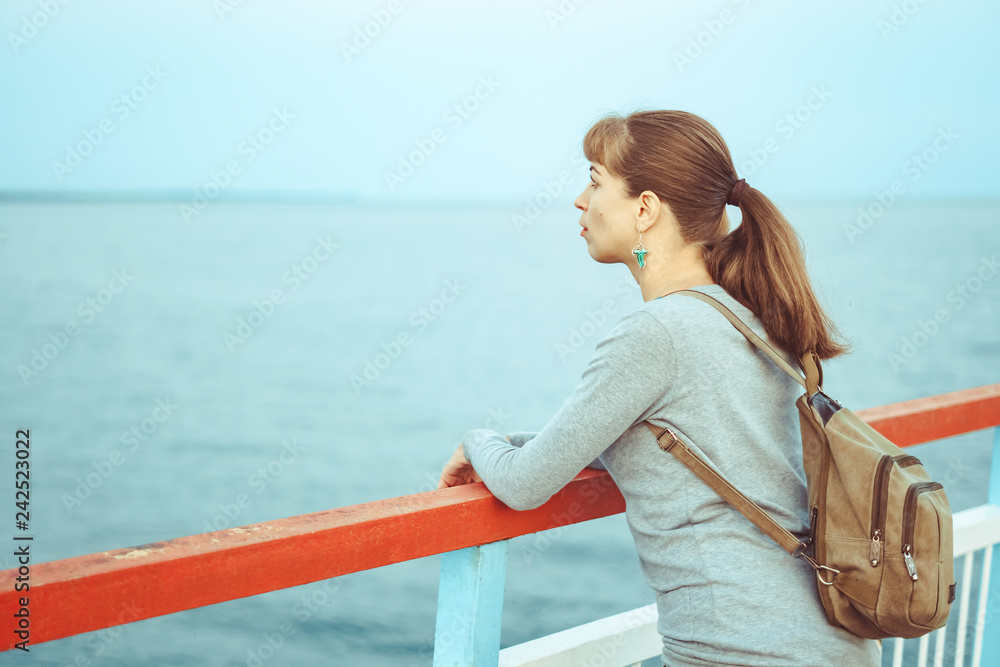 girl standing on the pier girl standing on the pier