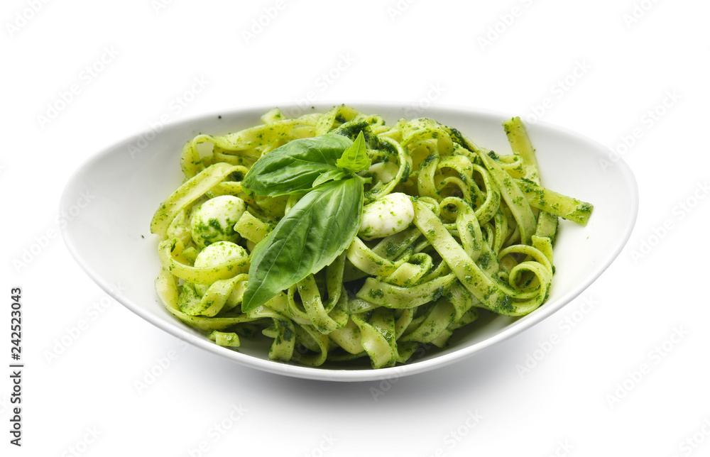 Plate with tasty pesto pasta on white background Plate with tasty pesto pasta on white background